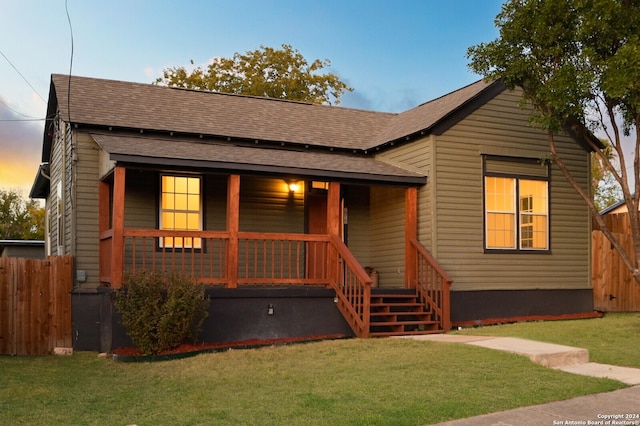 view of front of house featuring a yard and a porch