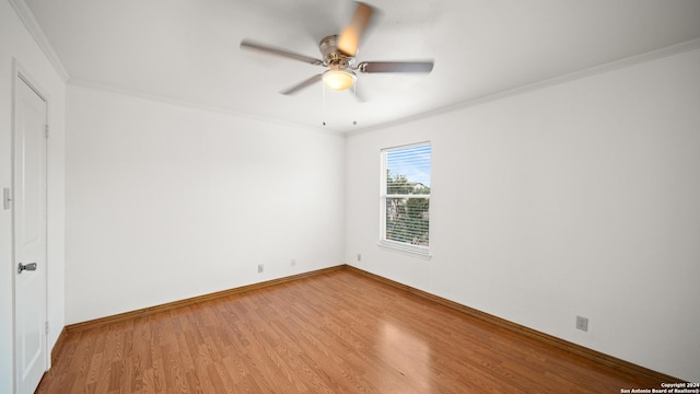 unfurnished room with crown molding, ceiling fan, and wood-type flooring