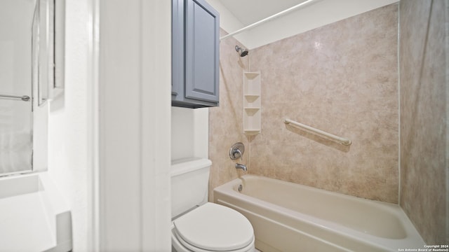 bathroom featuring toilet and tiled shower / bath