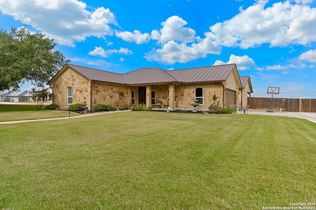 ranch-style house with a front lawn and a garage