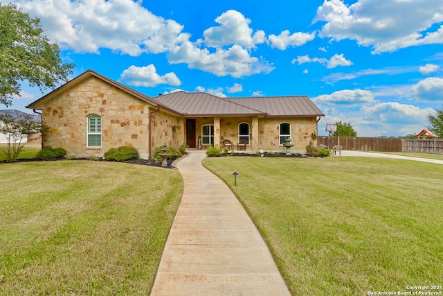 view of front of home with a front lawn