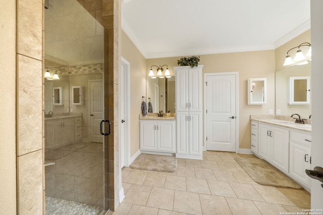 bathroom featuring tile patterned floors, vanity, a shower with shower door, and ornamental molding