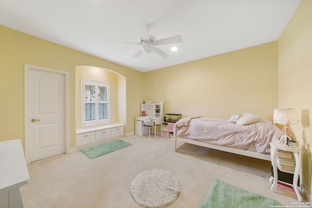 bedroom featuring light carpet and ceiling fan