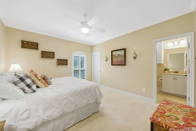 carpeted bedroom featuring ensuite bathroom, ceiling fan, and ornamental molding