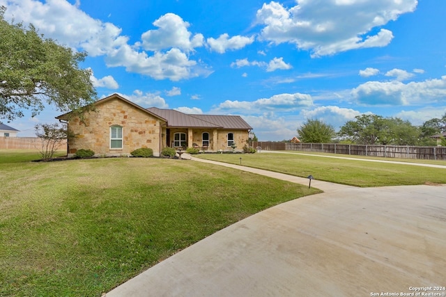 ranch-style home with a front lawn