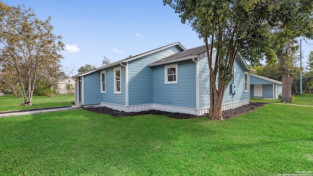 view of home's exterior with a lawn