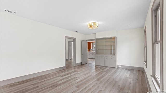 unfurnished room with light hardwood / wood-style floors