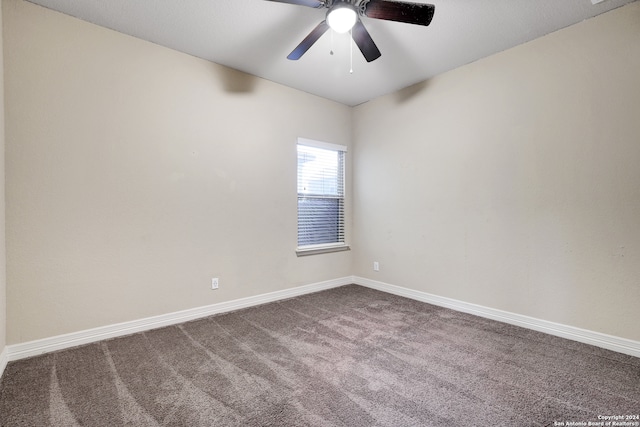 empty room featuring carpet flooring and ceiling fan