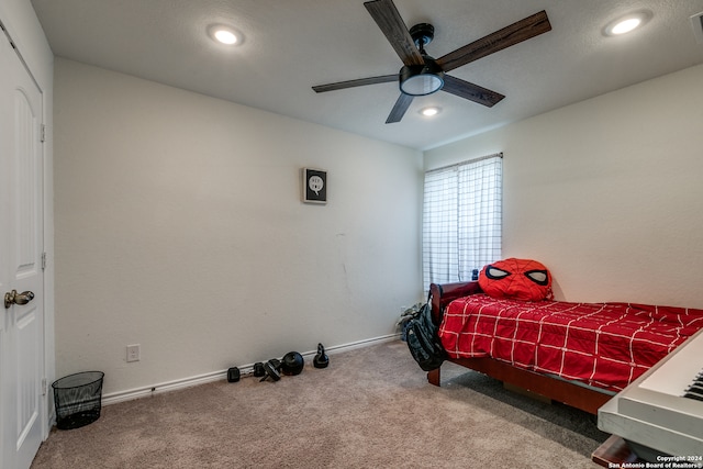 carpeted bedroom featuring ceiling fan