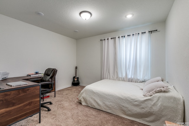 bedroom featuring light carpet