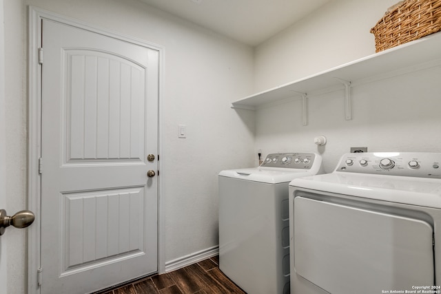 laundry room featuring dark hardwood / wood-style flooring and separate washer and dryer