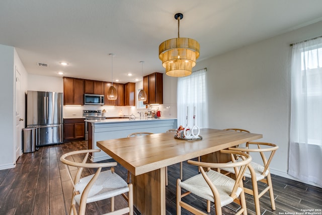 dining space featuring dark hardwood / wood-style flooring