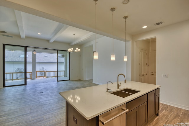 kitchen featuring dishwasher, sink, light wood-type flooring, an island with sink, and beam ceiling