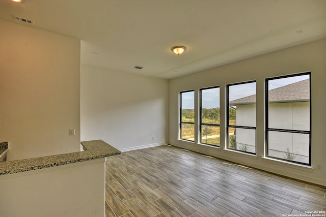 unfurnished living room featuring light wood-type flooring