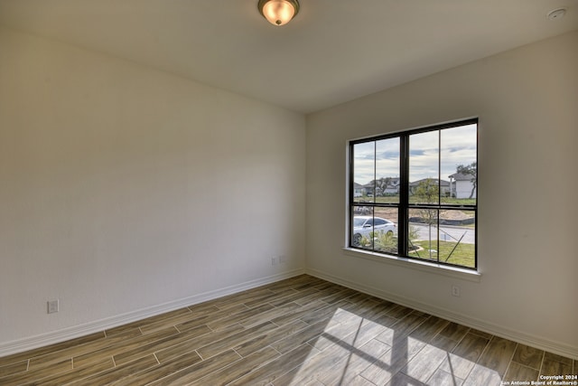 spare room with light hardwood / wood-style floors