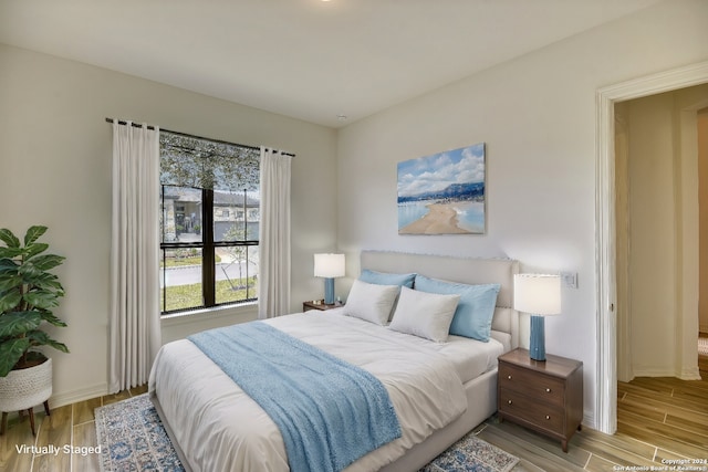 bedroom with light wood-type flooring