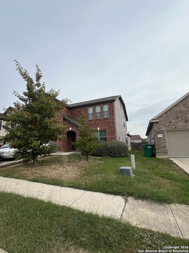 view of front of home with a front yard