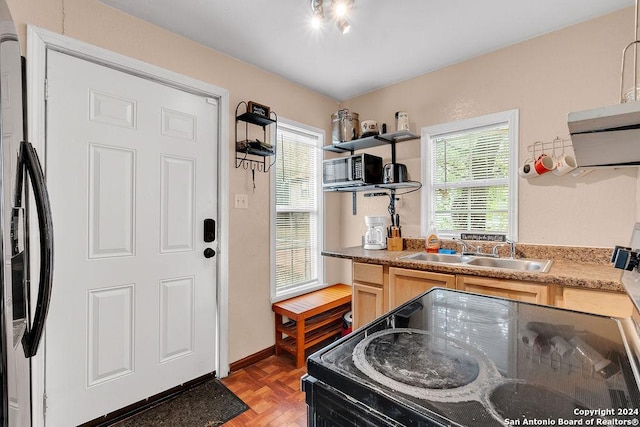 830 Canton, San Antonio, TX 78202 - kitchen featuring a sink, black appliances, open shelves, and light brown cabinets