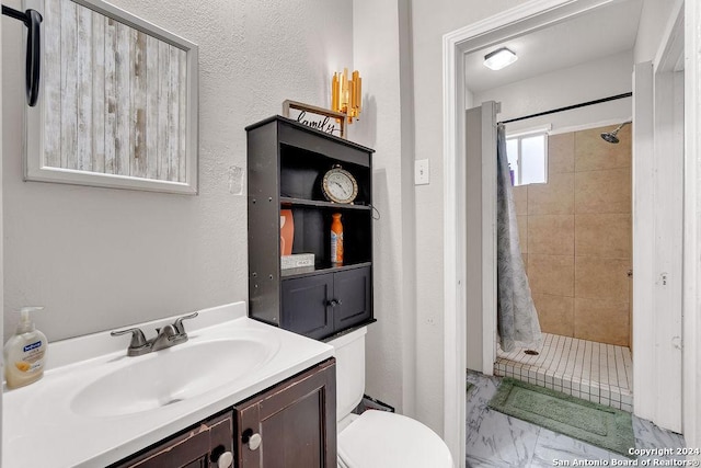 830 Canton, San Antonio, TX 78202 - full bathroom with a stall shower, toilet, vanity, and marble look tiles
