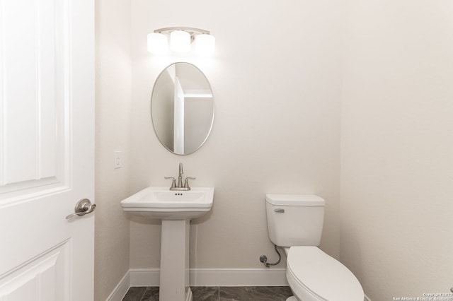 bathroom featuring toilet