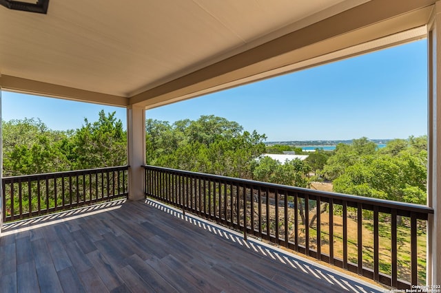 wooden deck with a water view