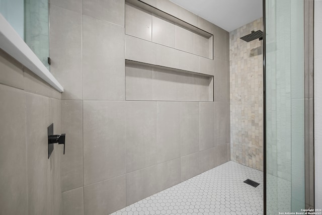 bathroom with tiled shower