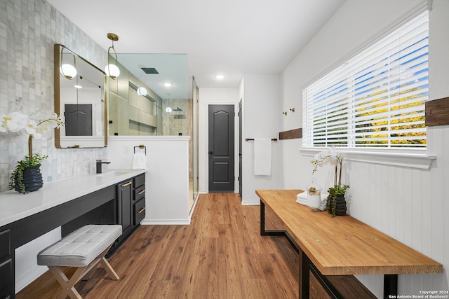 bathroom featuring vanity, an enclosed shower, and hardwood / wood-style flooring