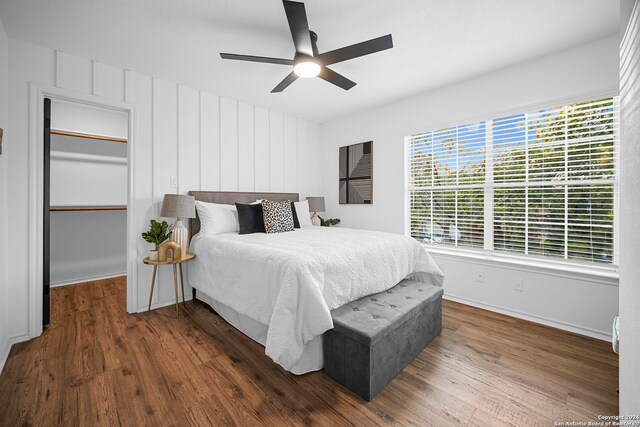 bedroom with ceiling fan and dark wood-type flooring