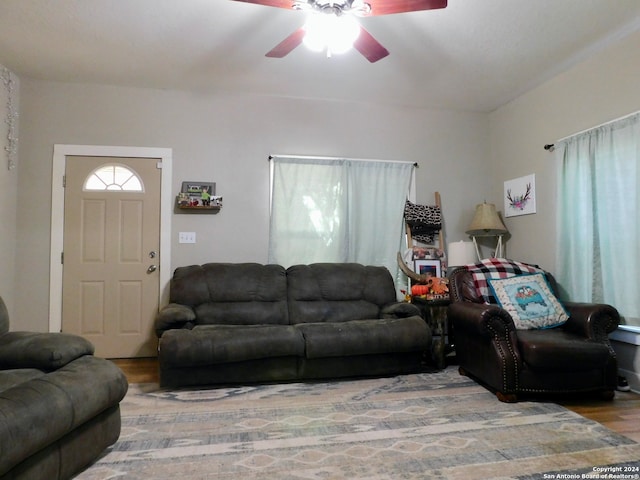 living room featuring hardwood / wood-style flooring and ceiling fan