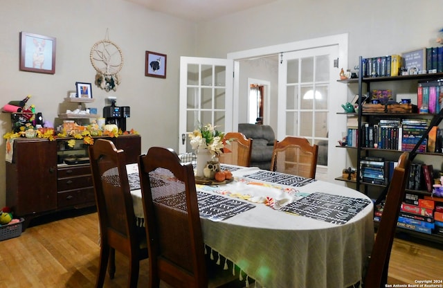 dining room featuring light hardwood / wood-style floors and french doors