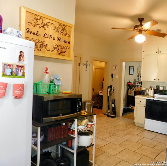 kitchen with white cabinets, ceiling fan, white appliances, and light tile patterned floors