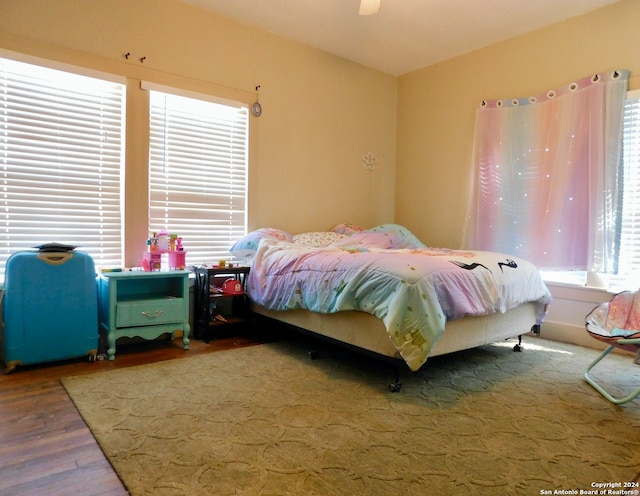 bedroom featuring wood-type flooring and ceiling fan