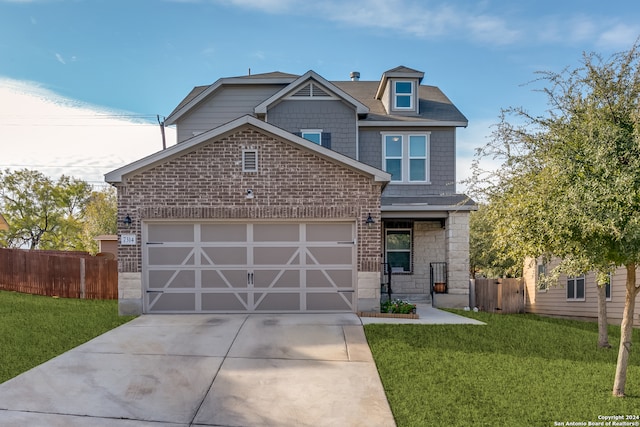 craftsman inspired home featuring a garage and a front yard