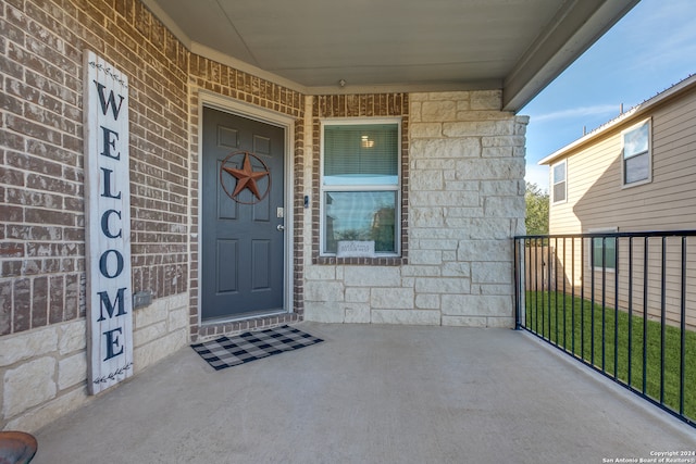 doorway to property with a porch