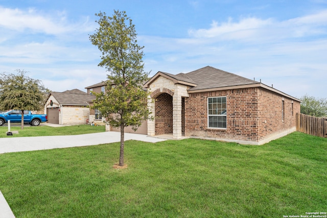 ranch-style house with a front yard and a garage