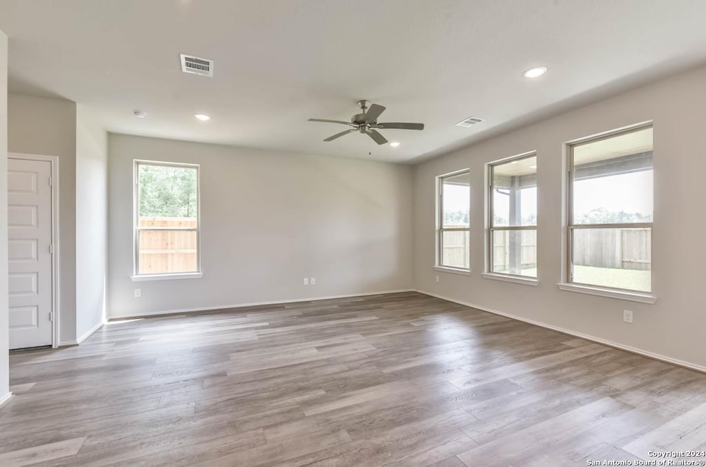 14344 Iron Knight, San Antonio, TX 78253 - spare room featuring ceiling fan, wood finished floors, baseboards, and recessed lighting