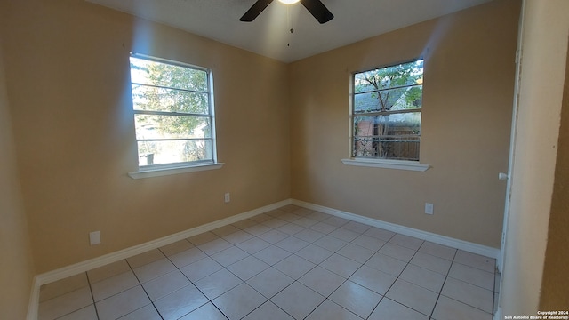 unfurnished room with ceiling fan, plenty of natural light, and light tile patterned floors