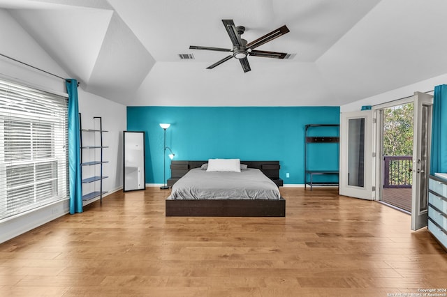 bedroom with access to exterior, ceiling fan, french doors, light hardwood / wood-style floors, and lofted ceiling