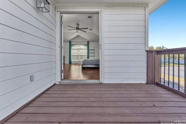 wooden deck featuring ceiling fan