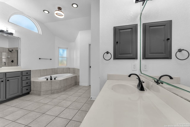 bathroom with vanity, tiled tub, tile patterned flooring, electric panel, and lofted ceiling