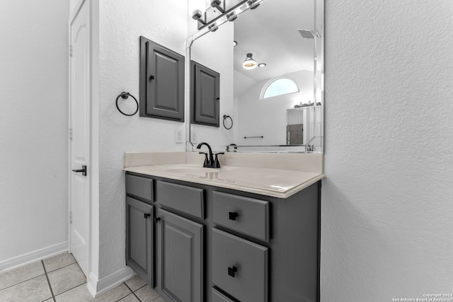 bathroom featuring tile patterned flooring and vanity