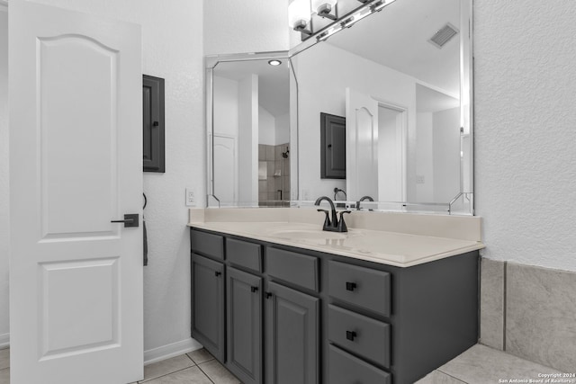 bathroom featuring tile patterned floors and vanity