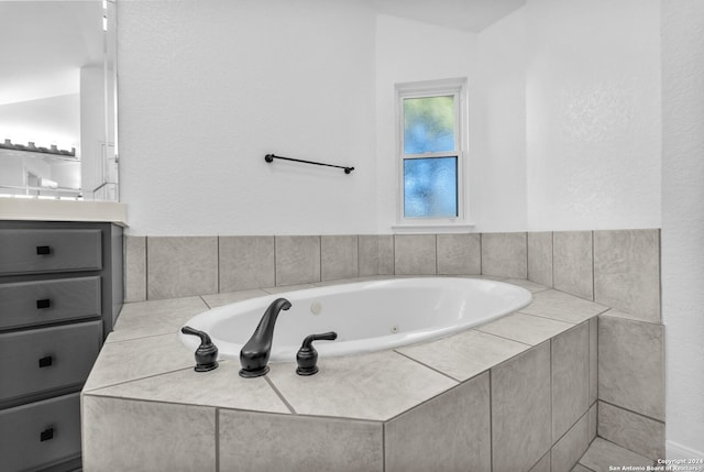 bathroom with a relaxing tiled tub and vaulted ceiling