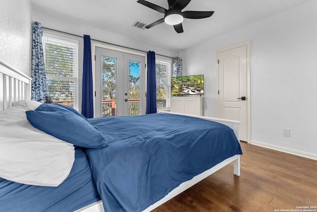 bedroom featuring ceiling fan, dark wood-type flooring, access to outside, and multiple windows