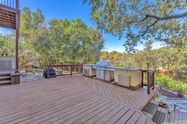 wooden terrace featuring grilling area