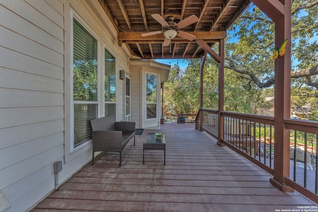 wooden terrace featuring ceiling fan