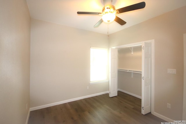 unfurnished bedroom featuring a closet, ceiling fan, and dark hardwood / wood-style flooring