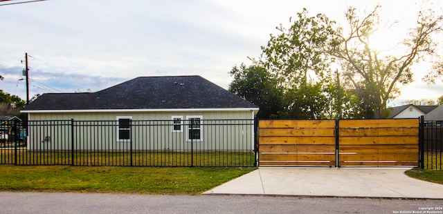 view of side of home featuring a lawn