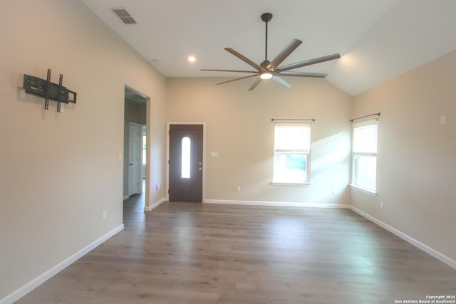 entryway featuring ceiling fan, dark wood-type flooring, and vaulted ceiling