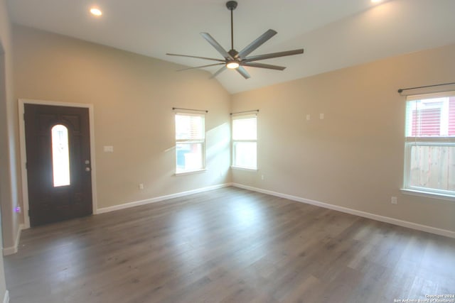 interior space with vaulted ceiling, ceiling fan, and dark hardwood / wood-style floors